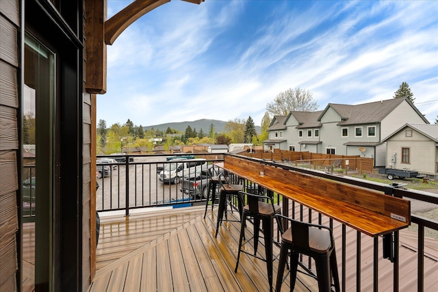 balcony featuring a mountain view and a residential view