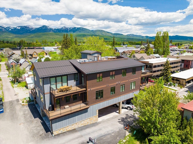 aerial view of residential area featuring a mountain backdrop