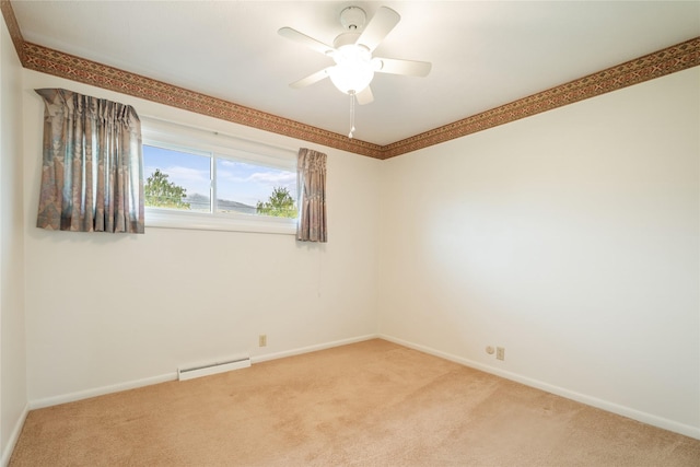 spare room with light colored carpet, baseboards, and ceiling fan