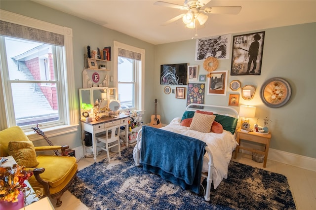 bedroom featuring baseboards and ceiling fan