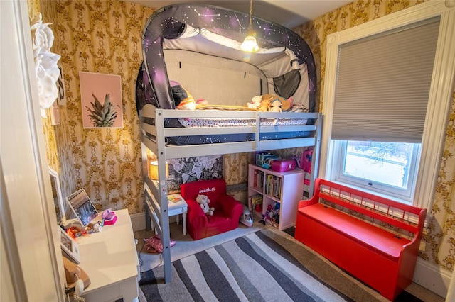 bedroom featuring wallpapered walls and carpet floors