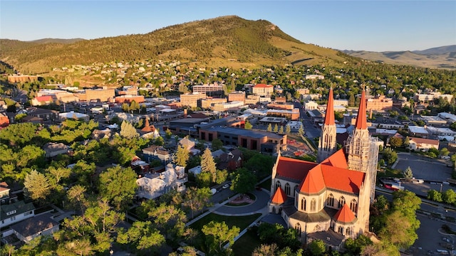 aerial view of residential area featuring mountains