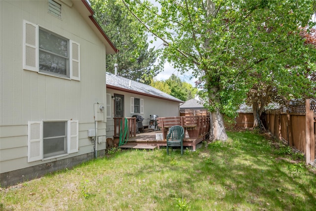 view of yard featuring a wooden deck