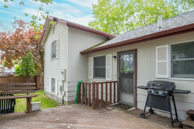 wooden terrace featuring fence and area for grilling