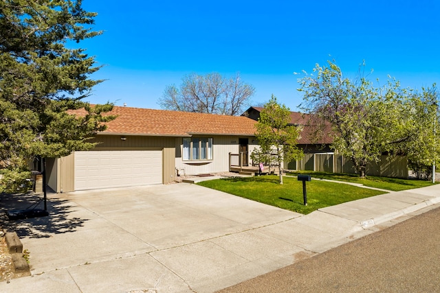 single story home featuring an attached garage and driveway