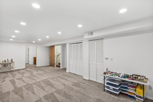finished basement with recessed lighting, carpet floors, baseboards, and stairs