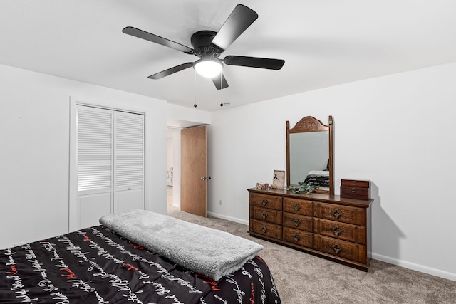 bedroom featuring carpet, a closet, a ceiling fan, and baseboards