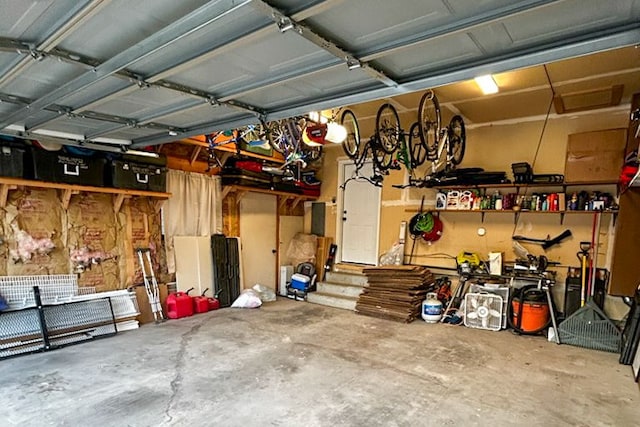 garage featuring a workshop area and a garage door opener