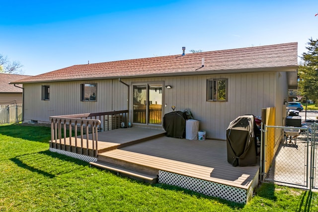 back of house featuring a deck