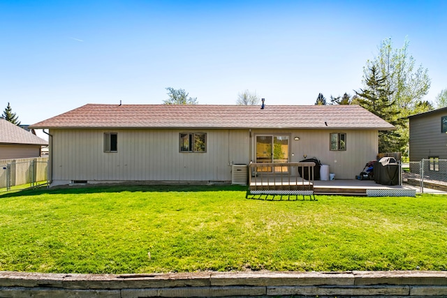 back of property featuring a wooden deck