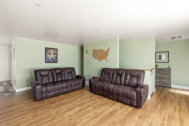 living area featuring wood finished floors and baseboards