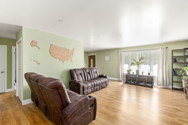 living room featuring light wood-style flooring and baseboards