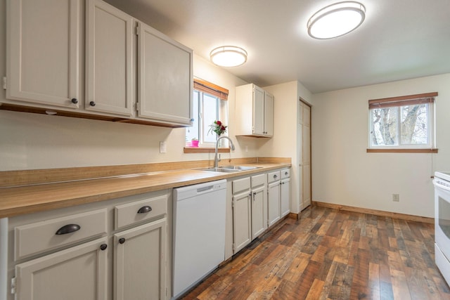 4 Rocky Mountain Dr, Whitehall, MT 59759 - kitchen with white appliances, a sink, dark wood-style floors, light countertops, and plenty of natural light