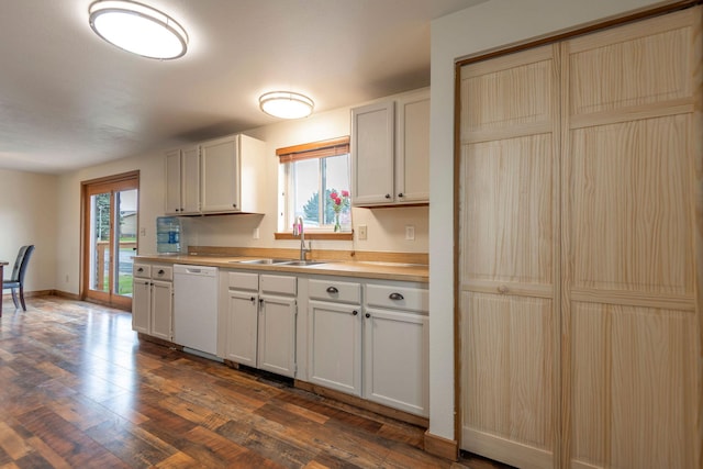 4 Rocky Mountain Dr, Whitehall, MT 59759 - kitchen with white dishwasher, a sink, light countertops, dark wood-style floors, and baseboards
