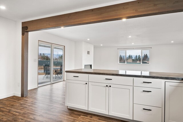 135 Meadow Ln, Victor, MT 59875 - kitchen featuring dark countertops, recessed lighting, white cabinetry, dark wood finished floors, and baseboards
