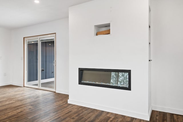 135 Meadow Ln, Victor, MT 59875 - unfurnished living room featuring dark wood-style floors, baseboards, and recessed lighting
