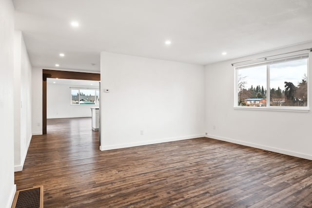 135 Meadow Ln, Victor, MT 59875 - spare room with dark wood finished floors, recessed lighting, and baseboards