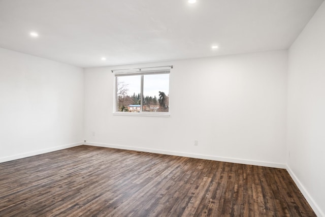 135 Meadow Ln, Victor, MT 59875 - spare room featuring dark wood-type flooring, baseboards, and recessed lighting