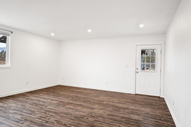 135 Meadow Ln, Victor, MT 59875 - spare room featuring dark wood-type flooring, recessed lighting, and baseboards