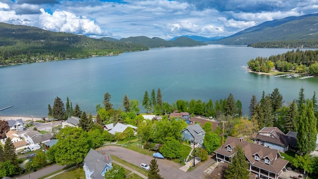 211 Idaho Ave, Whitefish, MT 59937 - aerial perspective of suburban area featuring a water and mountain view and a heavily wooded area