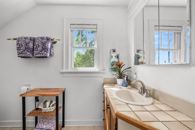 211 Idaho Ave, Whitefish, MT 59937 - bathroom with lofted ceiling and vanity