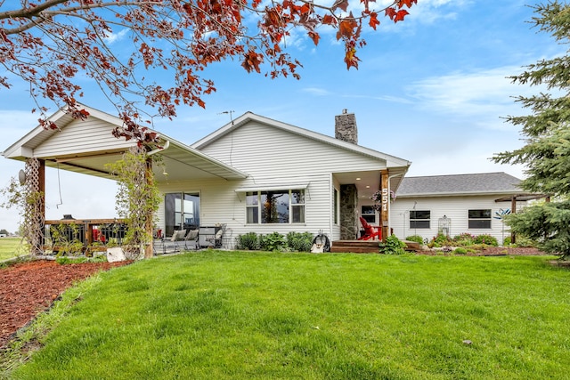 551 Fox Meadow Ln, Hamilton, MT 59840 - rear view of property featuring a chimney and a yard