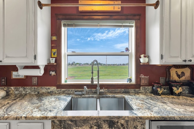 551 Fox Meadow Ln, Hamilton, MT 59840 - kitchen featuring a sink, white cabinets, and light stone counters