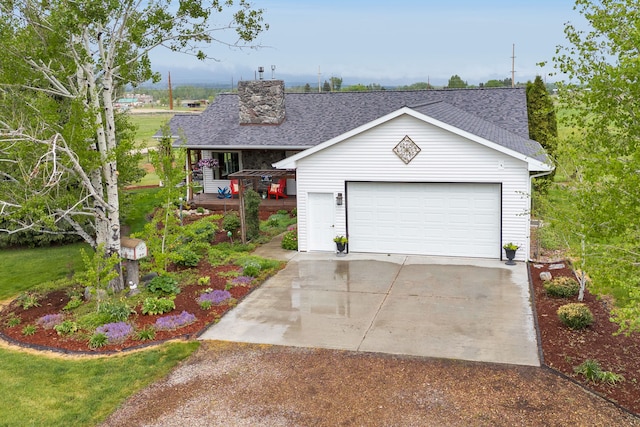 551 Fox Meadow Ln, Hamilton, MT 59840 - view of front of home with a shingled roof, an outdoor structure, and a garage