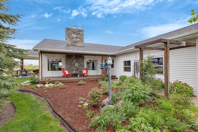 551 Fox Meadow Ln, Hamilton, MT 59840 - back of house featuring a chimney and roof with shingles