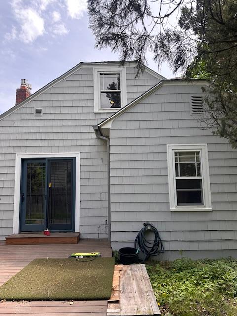 339 E Beckwith Ave, Missoula, MT 59801 - rear view of house featuring a chimney and a deck