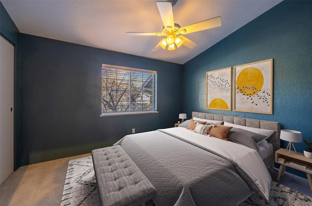 bedroom featuring vaulted ceiling, carpet flooring, and ceiling fan