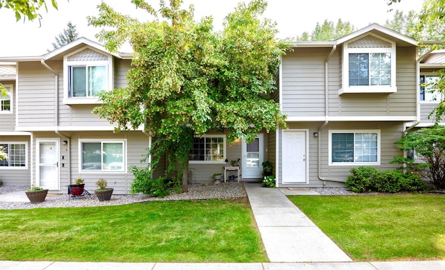 view of property with a front lawn