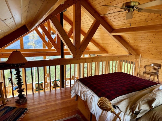 bedroom with wooden ceiling, beamed ceiling, hardwood / wood-style floors, and high vaulted ceiling