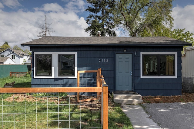 2112 W Central Ave, Missoula, MT 59801 - view of front of property with fence and a shingled roof