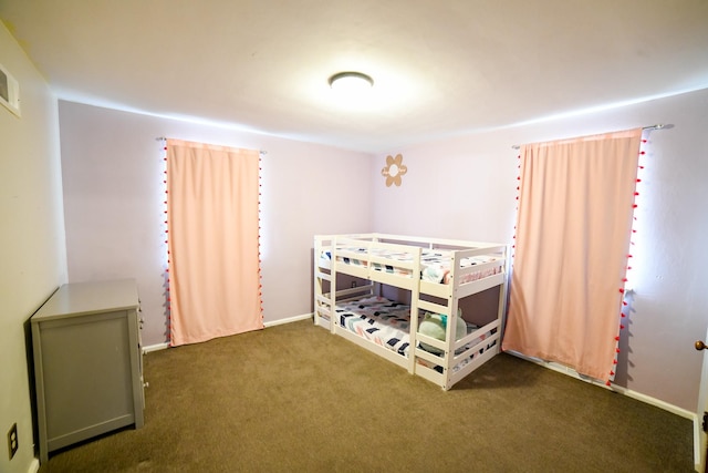 bedroom with carpet and baseboards