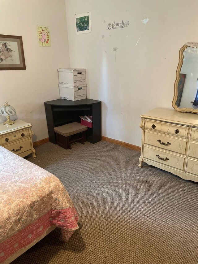 174 Badger Trl, Eureka, MT 59917 - carpeted bedroom featuring baseboards