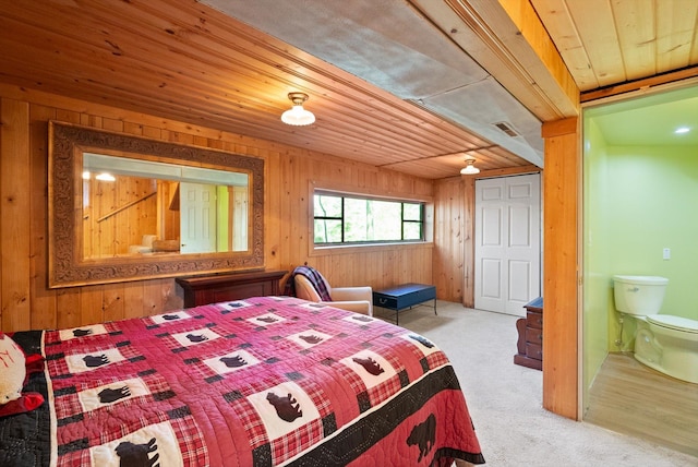 carpeted bedroom featuring wood walls and wood ceiling