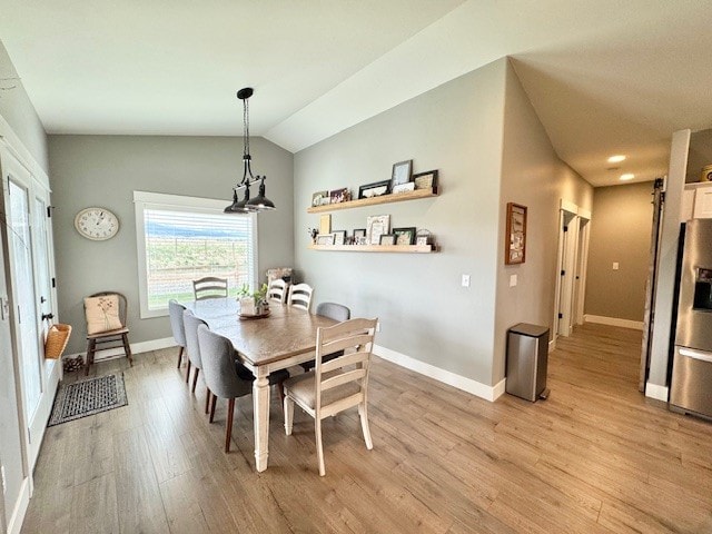 3975 Jaycee Ct Unit B, East Helena, MT 59635 - dining room featuring light wood finished floors, baseboards, vaulted ceiling, and recessed lighting
