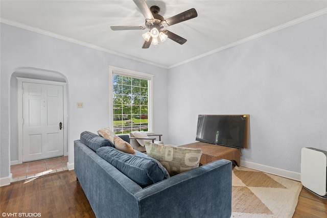 1004 2nd Ave E, Kalispell, MT 59901 - living room with wood finished floors, arched walkways, ornamental molding, ceiling fan, and baseboards