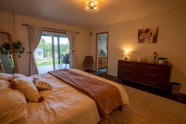 bedroom featuring access to outside, dark wood finished floors, and baseboards