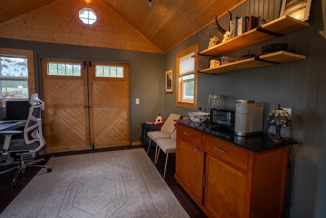 home office featuring vaulted ceiling, dark wood-style flooring, wood ceiling, and wood walls