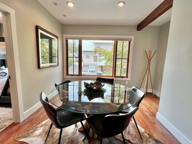 dining area featuring healthy amount of natural light, baseboards, recessed lighting, and wood finished floors