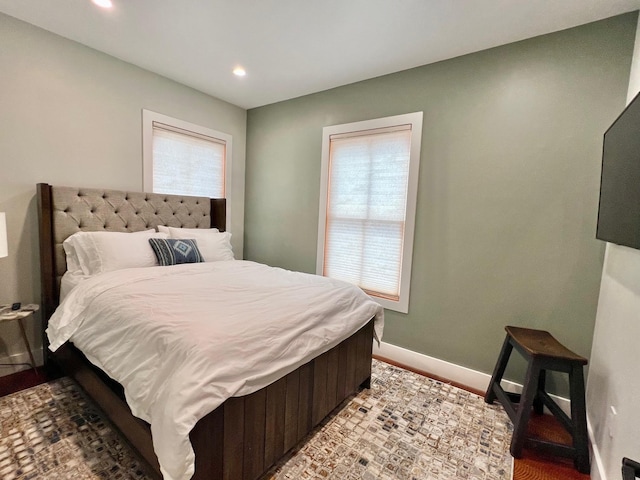 bedroom with recessed lighting and baseboards
