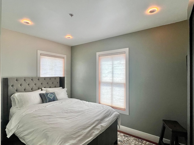 bedroom with baseboards and recessed lighting