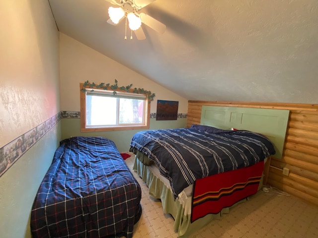 8807 W Fork Rd, Darby, MT 59829 - bedroom with vaulted ceiling, log walls, and ceiling fan