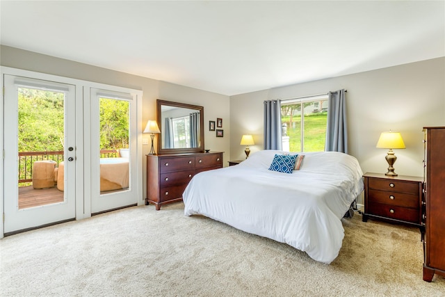 carpeted bedroom with access to exterior