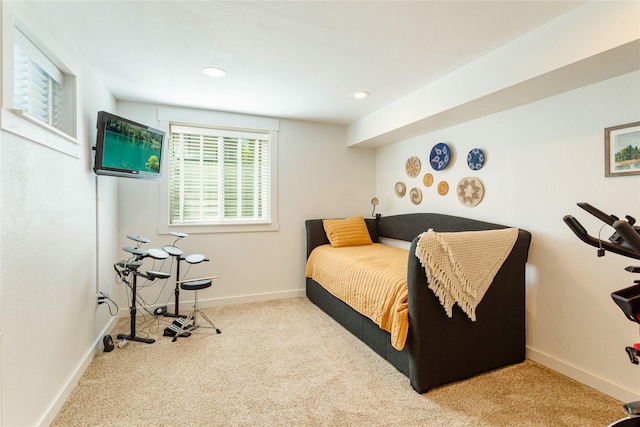 carpeted bedroom featuring baseboards and recessed lighting