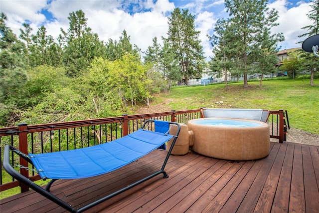 wooden terrace featuring a lawn and outdoor dining space