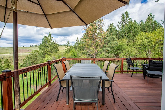 deck with outdoor dining area