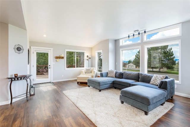 living area with dark wood-style floors, baseboards, vaulted ceiling, and recessed lighting
